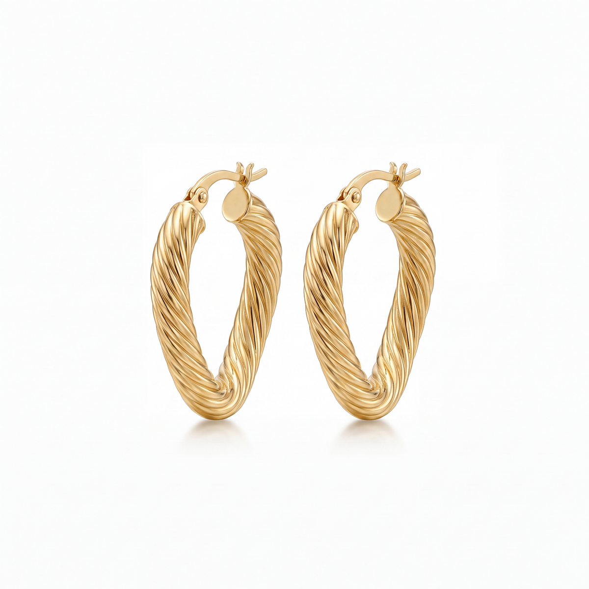 Shop elegant 14K yellow gold wavy hoop earrings at GoldFather Jewelry. Featuring a modern curved design, these gold hoops add timeless luxury to any look.