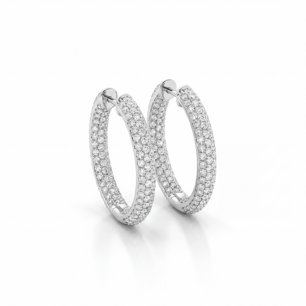 Shop luxurious 18K white gold inside-out hoop earrings featuring 6.12 carats of diamonds. Discover brilliant diamond hoops at GoldFather Jewelry.