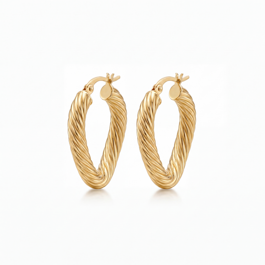 Shop elegant 14K yellow gold wavy hoop earrings at GoldFather Jewelry. Featuring a modern curved design, these gold hoops add timeless luxury to any look.